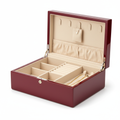 Luxury lacquered jewelry box open with satin interior and ring rolls